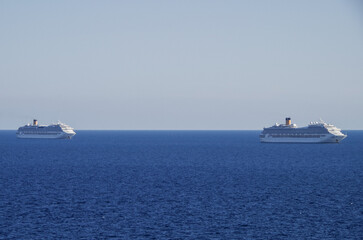 Mega family cruiseship cruise ship liners Favolosa and Fortuna anchored offshore of Civitavecchia...