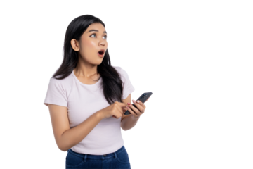 Surprised young Asian woman holding smartphone with open mouth, looking away with shocked expression, isolated on transparent background