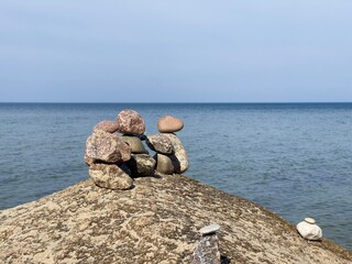 Sea stones built into a tower on the seashore.