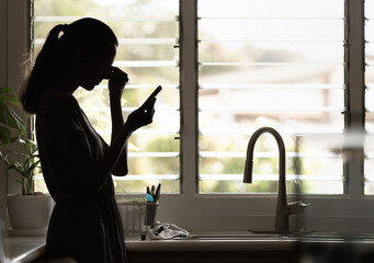 Sad emotional woman holding phone, stressed, exhausted, frustrated, getting bad news
