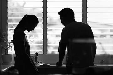 unhappy crying frightened woman, aggressive man quarreling at home. Angry husband emotionally...
