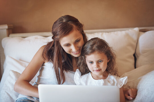 Mother, kid and relax on bed with laptop for streaming subscription, cartoon and online video in home. Happy family, woman and girl in bedroom with technology for social media, bonding and child film