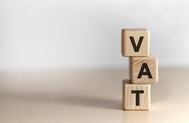 VAT - text on wooden cubes text on a background