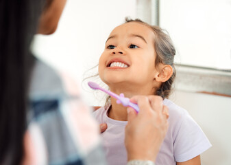 Brushing teeth, love and smile of mother and daughter in bathroom of home for hygiene together....