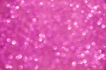 A soft pink bokeh-style background with unfocused light creates an elegant space for text or design elements.