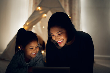 Mother, girl and tablet at night in home, streaming series and online for movie subscription. Mom,...