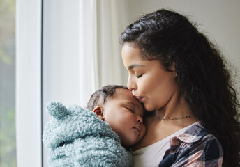 Obraz premium Mother, baby sleeping and kiss in home, trust and child dream on weekend in mommy embrace. Mom, infant nap and love to nurture in apartment for bonding, support kid and parent for peace in childhood