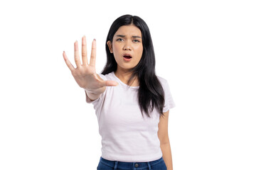 Young Asian woman showing stop gesture with hand, expressing refusal, disagreement, or warning, isolated on transparent background