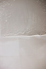 Applying a white leveling layer to the wall - filling the surface for leveling - finishing for painting or wallpaper