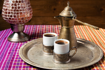 still life with a middle eastern coffee set, on wooden table
