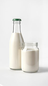 Bottle and glass of milk on a white background