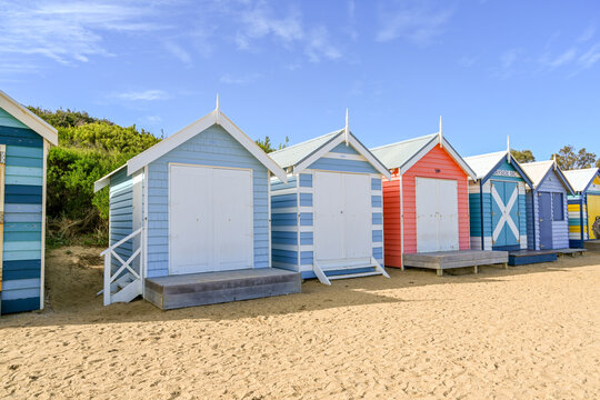MELBOURNE, VICTORIA, AUSTRALIA - JUNE 1, 2023: People walking on Brighton Beach, Melbourne, Australia