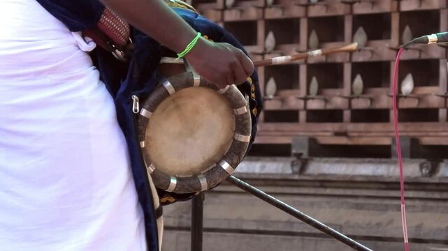 Artist playing Thavil, a South Indian percussion musical instrument