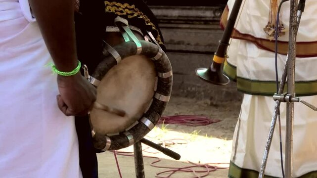 Artist playing Thavil, a South Indian percussion musical instrument