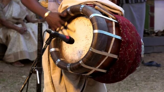 Artist playing Thavil, a South Indian percussion musical instrument