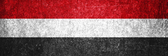 Yemen state flag on a metal surface. Banner of dirty grunge Yemen flag.
