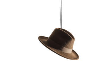 A vintage brown hat suspended in mid-air against a pure white backdrop creating a whimsical effect
