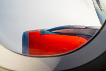 Jet engine close up of airplane against cloudscape