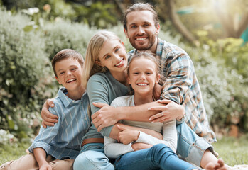 Fototapeta premium Family, portrait and garden hug for childcare, outdoor love and bonding together in Scotland. Parents, countryside and embrace children for security in relationship, vacation break and holiday trip