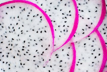 Fresh exotic tropical pitaya (pitahaya) fruit texture. Macro close-up of juicy dragon vegetarian diet fruit slices