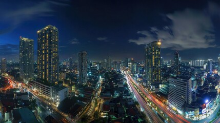 Naklejka premium Bustling city street with buildings lit up and cars moving