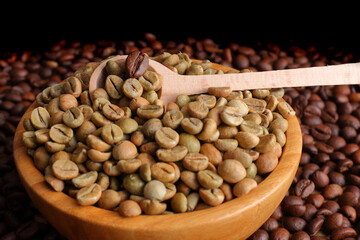 Green and Roasted Coffee Beans in a Wooden Bowl with Spoon with copy-Space