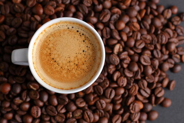 Top view of White Espresso Cup on a Bed of Toasted Coffee Beans