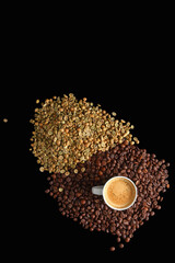 Top view of Espresso Cup Surrounded by Roasted and Raw Coffee Beans on a Dark Background with copy-space