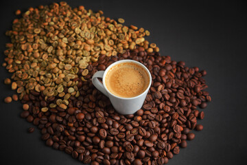 Coffee Cup with a Blend of Roasted and Green Coffee Beans on a Dark Backdrop