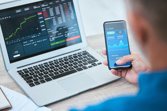 Man, smartphone and laptop or trading on stock market, fintech and analyse growth graphs for investment. Investor, blockchain and statistics or currency conversion, financial app and business screen - Powered by Adobe