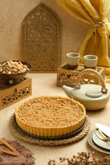 Apple pie on brown background. Delicious apple pie before cutting.
