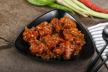 Manchurian chicken with sauce and spices