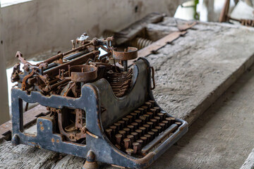 old typewriter. antique writing instrument. old worn and rusty typewriter.