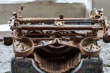 old typewriter. antique writing instrument. old worn and rusty typewriter.