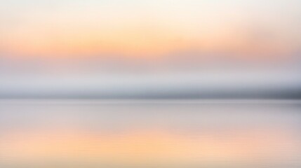 Obraz premium A tranquil scene of a foggy lake reflecting the sunrise