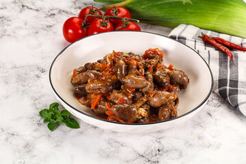 Baked chicken hearts with vegetables