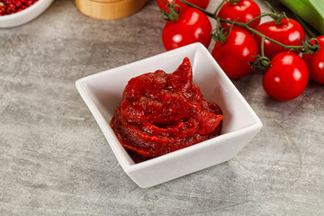 Red tomato paste in the bowl