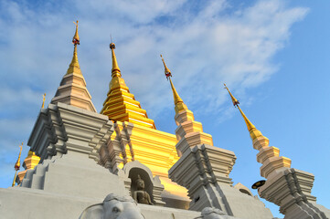Golden Pagoda, Lanna Architecture in Evening vibes with natural landscapes at Wat Pa Ratchadaram in...