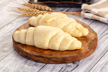 Raw uncooked croissant for bake
