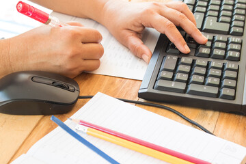 hand of working woman check financial and work computer for business at office desk