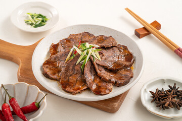 Taiwanese braised beef shank slices in a plate on white table background.