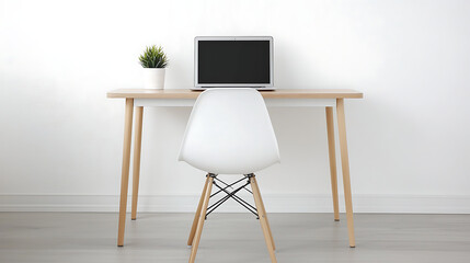 A white office desk with a laptop and a potted plant
