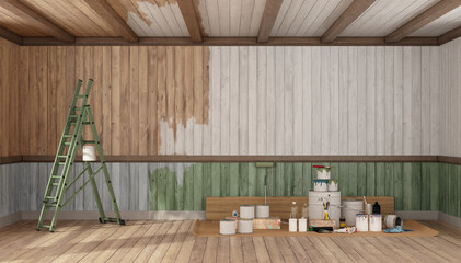 Painting walls and wooden panels in empty room with ladder and paint cans