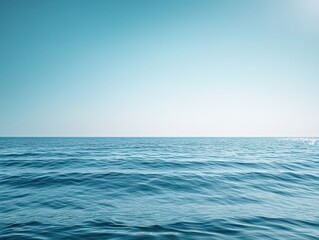 Endless blue horizon with smooth summer waves, minimalistic and calming coastal atmosphere