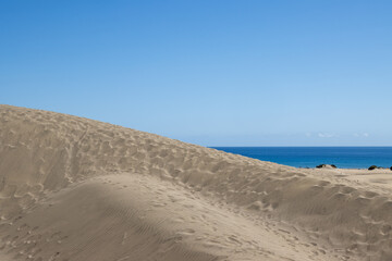 Sand dunes and Atlantic ocean, Gran Canaria, Spain