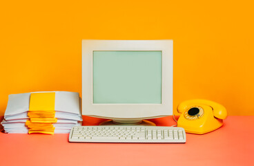 Vintage 80s office setup with CRT monitor and dial phone