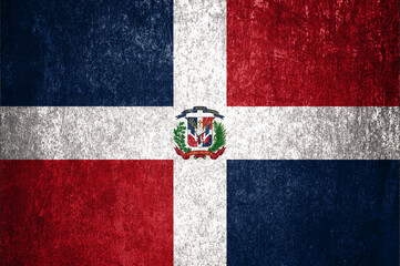 Dominican Republic state flag on a metal surface. Dirty grunge Dominican Republic  flag.