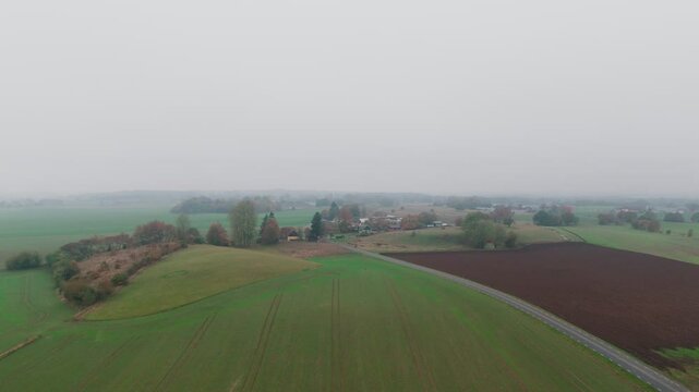 Aerial view of the countryside in &Ouml;sterlen, South Sweden, Foggy, Autumn, Fields, &Ouml;stra Vemmerl&ouml;v, Sk&aring;ne, Houses