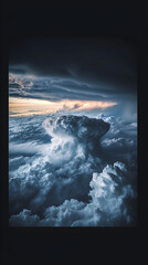 Majestic Updraft of Nature: A Dramatic Dance of Light and Shadow in a Towering Storm Cloud