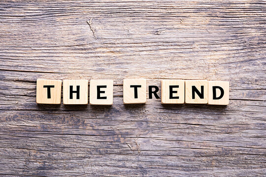 The Current Trend: Wooden Block Letters on Rustic Wood Background